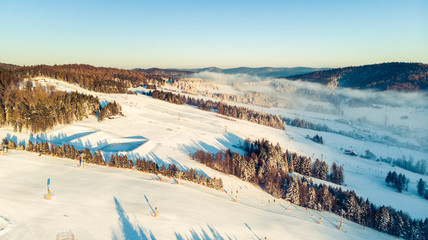 Wall Mural - Aerial Panoramic View Over Valley in Winter Season. Slotwiny near Krynica in Poland