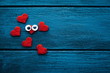 Small red hearts on wooden background. Valentines concept. Valetines background.