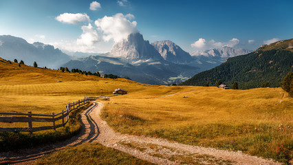 Fototapete - Beautiful alpine countryside. Awesome Alpine highlands in summer. Amazing Nature Scenery of Dolomites Alps. Epic Scene in the mountains place near Seceda peak. Val Gardena. Dolomiti alp. Italy