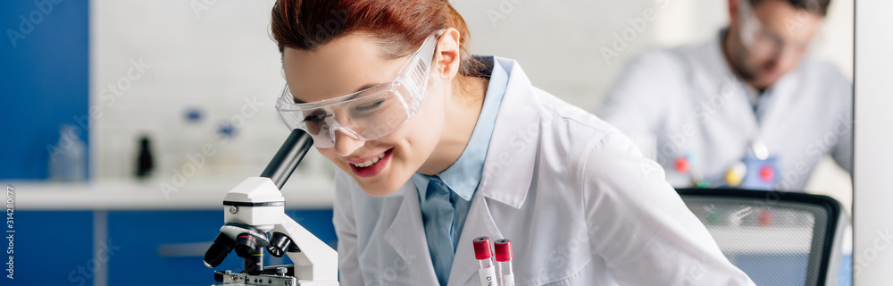 panoramic shot of genetic consultant doing dna test in lab - obrazy, fototapety, plakaty 