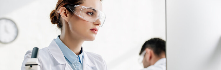 Wall Mural - panoramic shot of molecular nutritionists using computer in lab