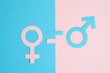 © Ksenia - male and female symbols cut out of paper and an equal sign on a pink and blue paper background. the concept of gender equality