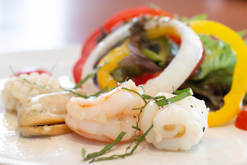 Wall Mural -  mixed seafood salad on white plate