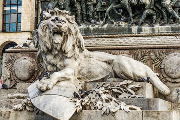 Wall Mural - Lion on the pedestal of the monument to Victor Emmanuel II in Milan, Italy