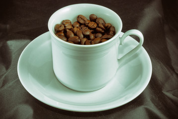 coffee cup with coffe beans