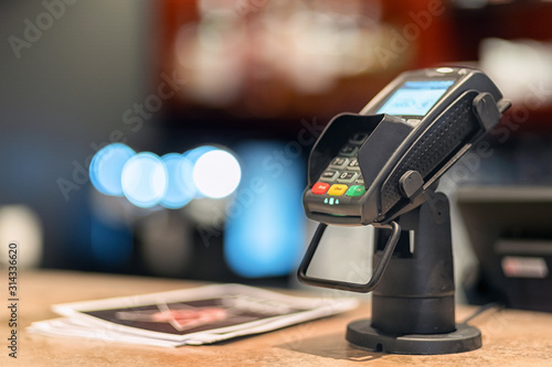 Fotomural Bank terminal and payment card on the office table