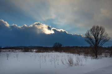 Wall Mural - Russia. South Of Western Siberia. Picturesque cold sunset on a snow-covered road in The mountain Shoria.