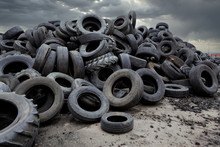 Industrial Landfill For The Processing Of Waste Tires And Rubber Tyres. Pile Of Old Tires And Wheels For Rubber Recycling. Tyre Dump