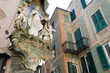 detail of facade Madonna staue old town street facade savona italy