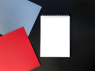 Mock up minimalist business composition. Empty notepad, red and grey paper blanks on blackboard. Male style. Top view. Copyspace.