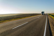 © Pokoman - hitchhiking, empty road, freedom of choice. car on the highway on a sunny day.