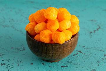 Wall Mural - Cheese Covered Balls on a Teal Table