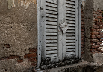 Wall Mural - Wood vintage window on the old wall, Western Architecture style, Selective focus.