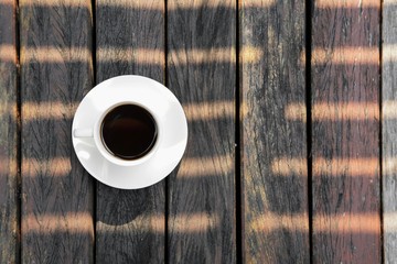 cup of coffee on wooden background