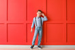 © Pixel-Shot - Cute fashionable boy on color background