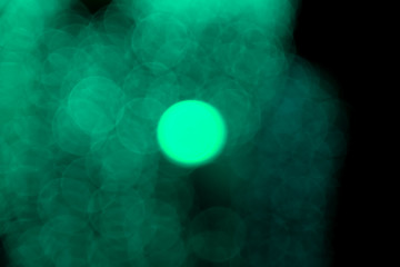 Defocused of blurred aqua menthe bokeh circle light from lighting bulb in the night for abstract background texture patterns