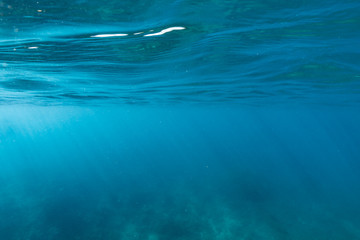 Underwater of tropical reef with sea  sun rays passing through water.