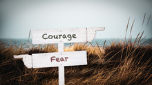 Street Sign To Courage Versus Fear