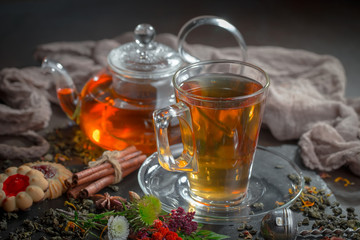 Tea hot drink on old background in composition on the table