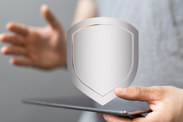 shield protection concept holding in hand digital