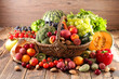 Leinwandbild Motiv assorted of fruit and vegetable in wicker basket