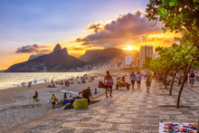 Sunset View Of Ipanema Beach With Mosaic Of Sidewalk, Leblon Beach And The Mountain Dois Irmao In Rio De Janeiro. Brazil