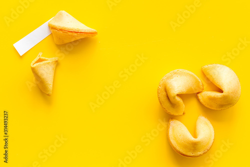 Traditional fortune cookies on yellow table top-down copy space Tableau sur Toile