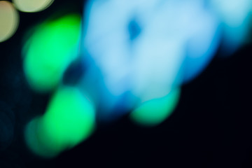 abstract bright blured colored bokeh. lights of the night city background.