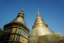 Two Golden Pagodas Against The Sky