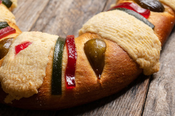 Kings day bread also called epiphany cake on wooden background