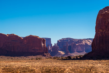 Wall Mural - A view of the geological formations in Monument Valley