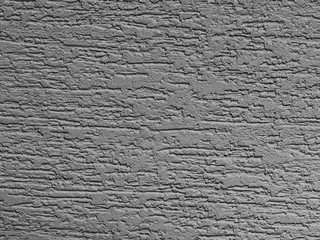 Silver background facade plaster . Monolithic plaster decorative backdrop. Single layer scraped cement plaster wallpaper. Exterior building structure backdrop. Silica sand cement wall plaster