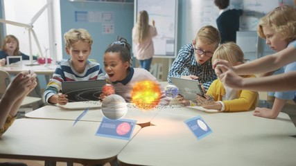 Wall Mural - group of school children in science class use digital tablet computers with augmented reality softwa