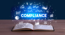 COMPLIANCE Inscription Coming Out From An Open Book, Business Concept