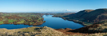 Beautiful Autumn Fall Landscape Of Ullswater And Surrounding Mountains And Hills Viewed From Hallin Fell On A Crisp Cold Morning With Majestic Sunlgiht On The Hillsides