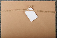 Brown Envelop With White Paper Tag