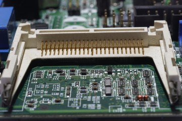 A CF card was pushing in a socket on a computer board.