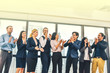 © Suriyo - Business people teamwork group are happy finished success business project standing in office congratulation