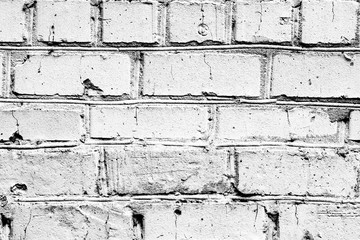 Texture of a brick wall with cracks and scratches which can be used as a background