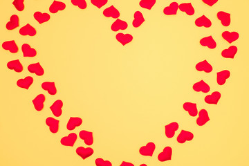 Heart shaped frame on yellow background. Copy space. Valentine's day concept.