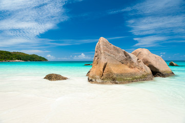 Wall Mural - Bright scenic view of granite boulder landscape of Anse Lazio beach on Praslin Island in the Seychelles