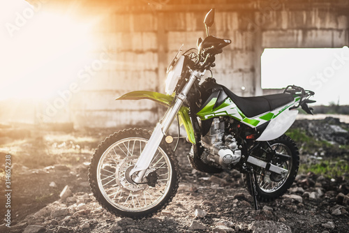 Fotomural Beautiful green off-road motorcycle Enduro or cross, in a contoured light