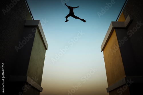 Cuadros en Lienzo Concept of jumping over obstacles, The silhouette of a man jumping between two tall buildings