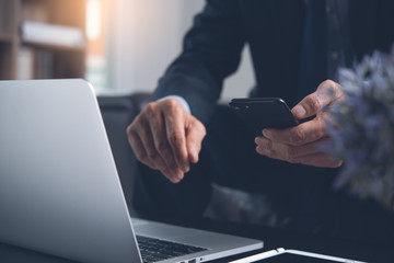 Wall Mural - Businessman using smartphone