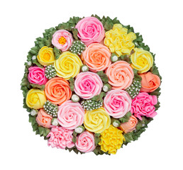 Wall Mural - Top view of colorful and beautiful cake topping decoration in roses pattern on white background with clipping path