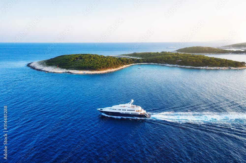 Aerial view on the luxury yacht at the day time. Adventure and travel.  Landscape with ship on Adriatic sea. Luxury cruise. Travel - image - obrazy, fototapety, plakaty 