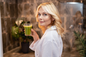 Caucasian woman with a healthy vegetable drink