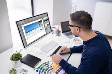 Wall Mural - Male Designer Working On Computer