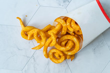 Take Away Curly Fries Ready To Eat With Sauce In Plastic Box Package / Container.