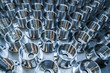 © lucky pics - a batch of shiny metal cnc aerospace parts production - close-up with selective focus for industrial background